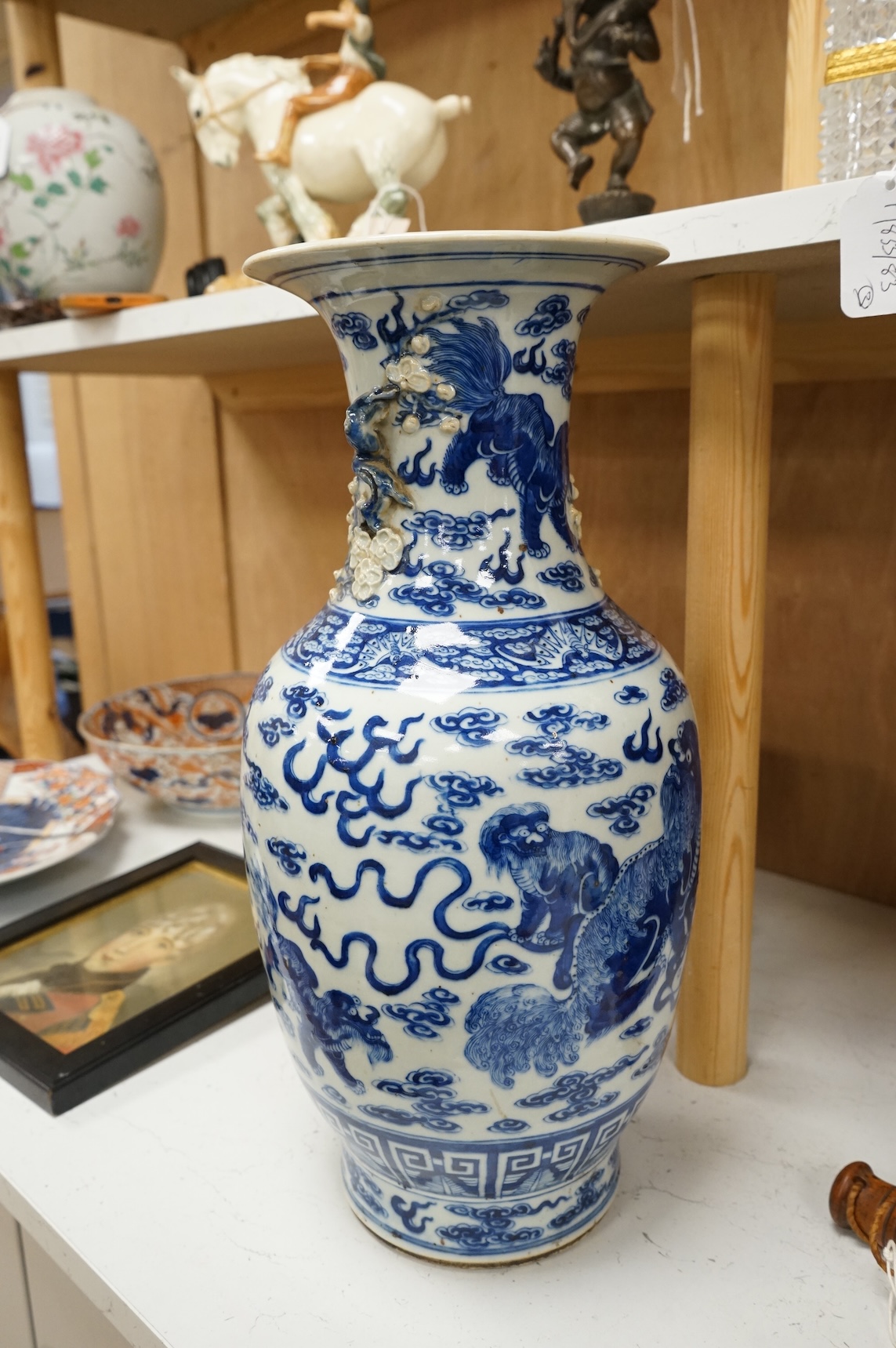 A Chinese baluster vase, painted with Buddhist lions in underglaze blue, 45cm high